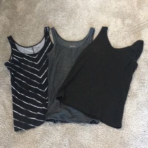 3 black and silver tank tops